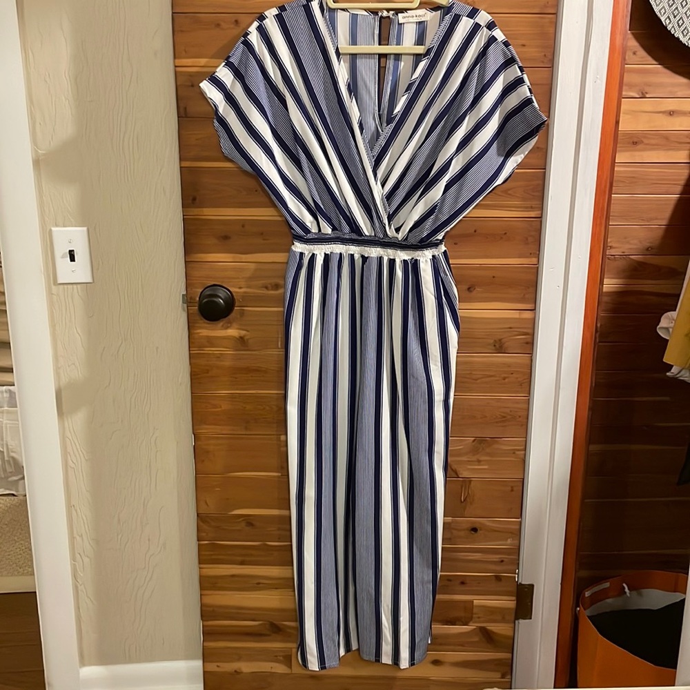 Jumpsuit hits at ankle. Silk material.